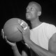Bill Russell eyeing the hoop with basketball in hand.