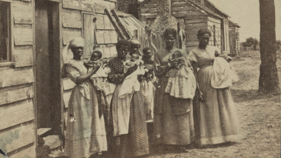 A photograph showing women holding babies