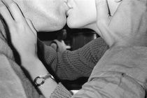 a black-and-white photo of two people kissing