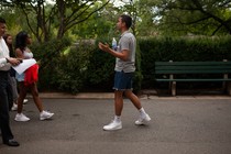 a campus tour guide leads a group of prospective students and families