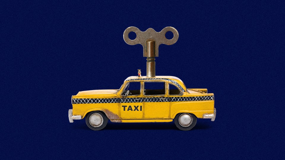 An image of a taxi with a wind-up mechanism on top