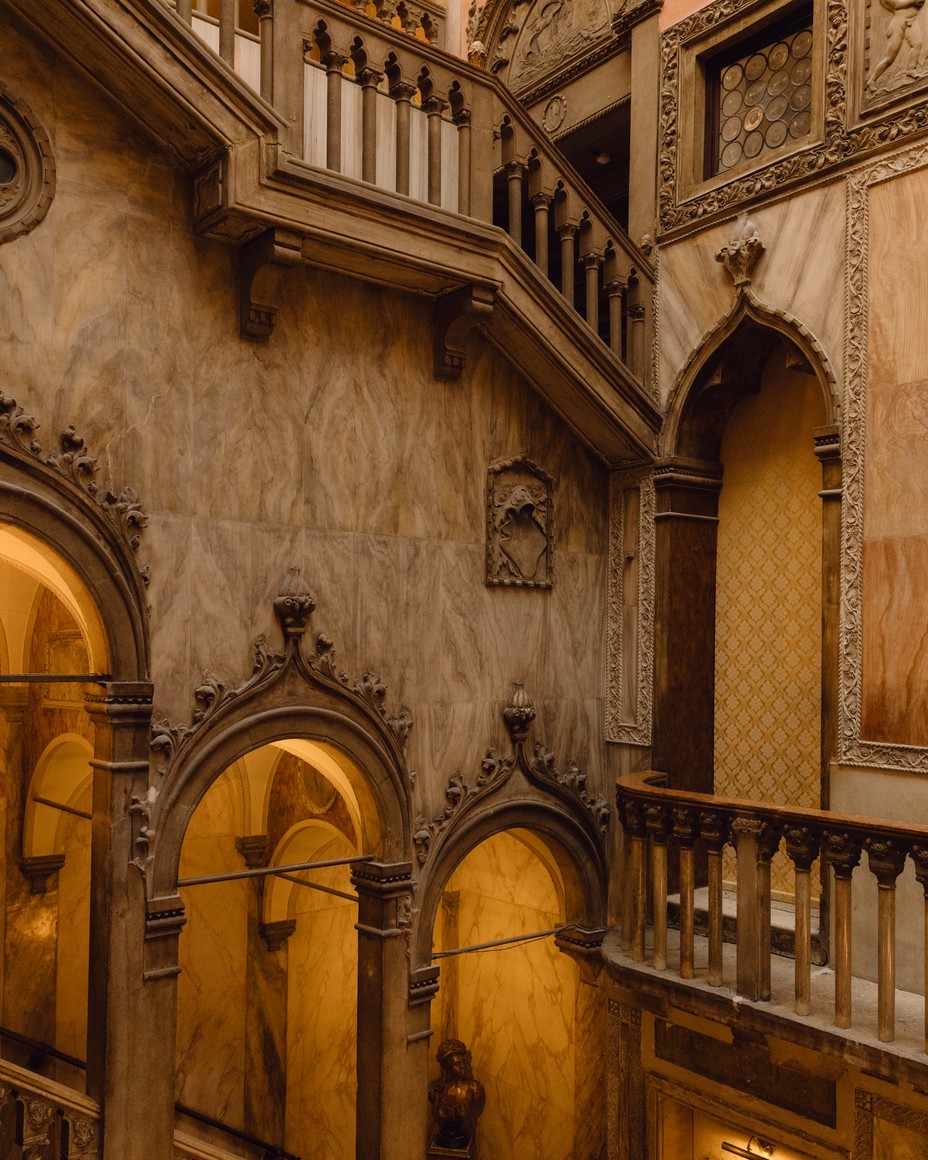The stately corridor and stairwell of the Hotel Danieli