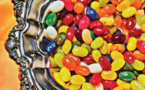 a close up of a silver dish full of colorful jelly beans