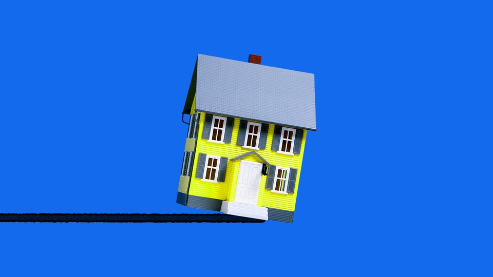 A yellow house tipping over in front of a blue background