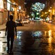 A person walks in the street at night in Syria