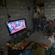 Members of the Iraqi forces watch Donald Trump giving a speech after he won the U.S. president election.