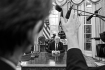 A reporter asks Donald Trump a question in the Oval Office.