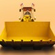 Elon Musk driving a big yellow construction bulldozer