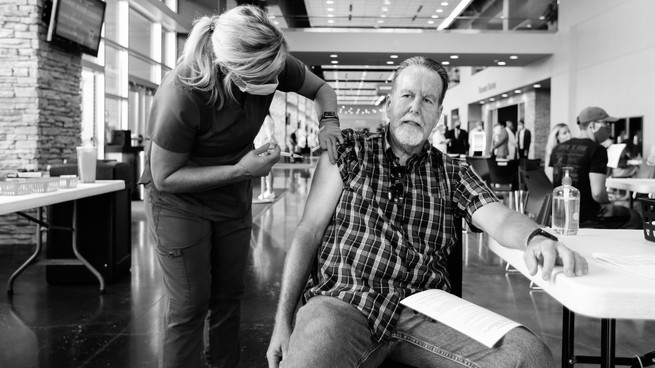 A man receives a COVID-19 vaccine