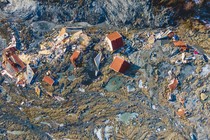 Houses torn from their foundations by a landslide