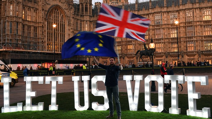 An anti-Brexit protester demonstrates in front of Parliament.