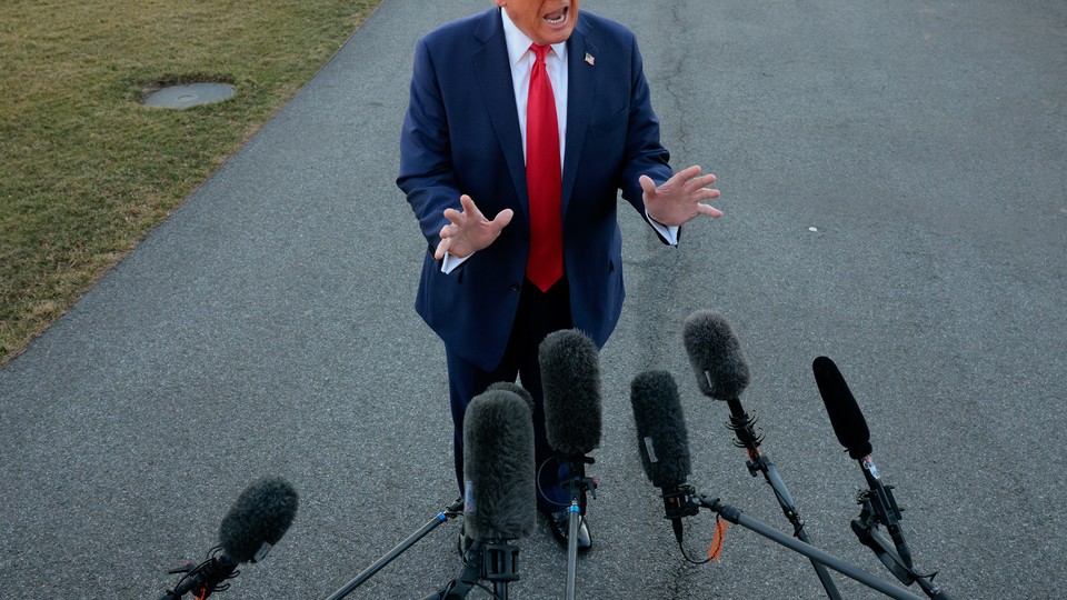 A news photo of President Donald Trump addressing members of the press
