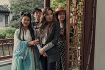 Four women in a Chinese garden looking offscreen in a scene from 'Joy Ride'