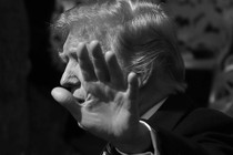 Donald Trump putting a hand in front of his face