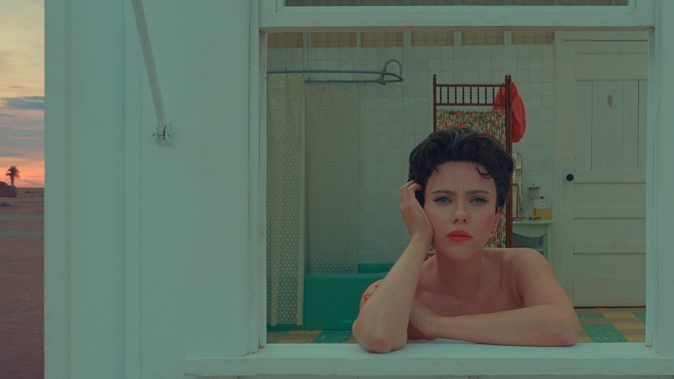 Scarlet Johansson stares intensely out the window of a bathroom in "Asteroid City."