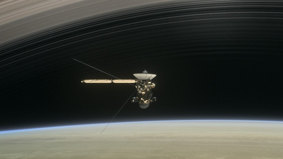 An artist’s illustration of Cassini between Saturn and the planet’s innermost rings