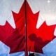 A photo featuring a Canadian flag's red-maple symbol.