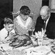 A family says grace before Thanksgiving dinner in the 1930s.