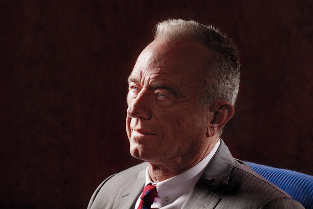 Head-and-shoulders photo portrait of RFK Jr. in three-quarter profile wearing suit and tie