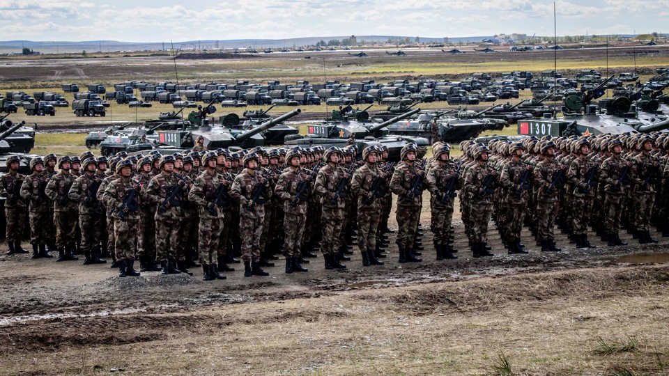 Chinese troops stand lined up in front of tanks during the Vostok-2018 exercises.