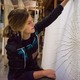 Artist Richelle Gribble with her cotton spider web on kozo washi paper, created during her artist-in-residency in Japan