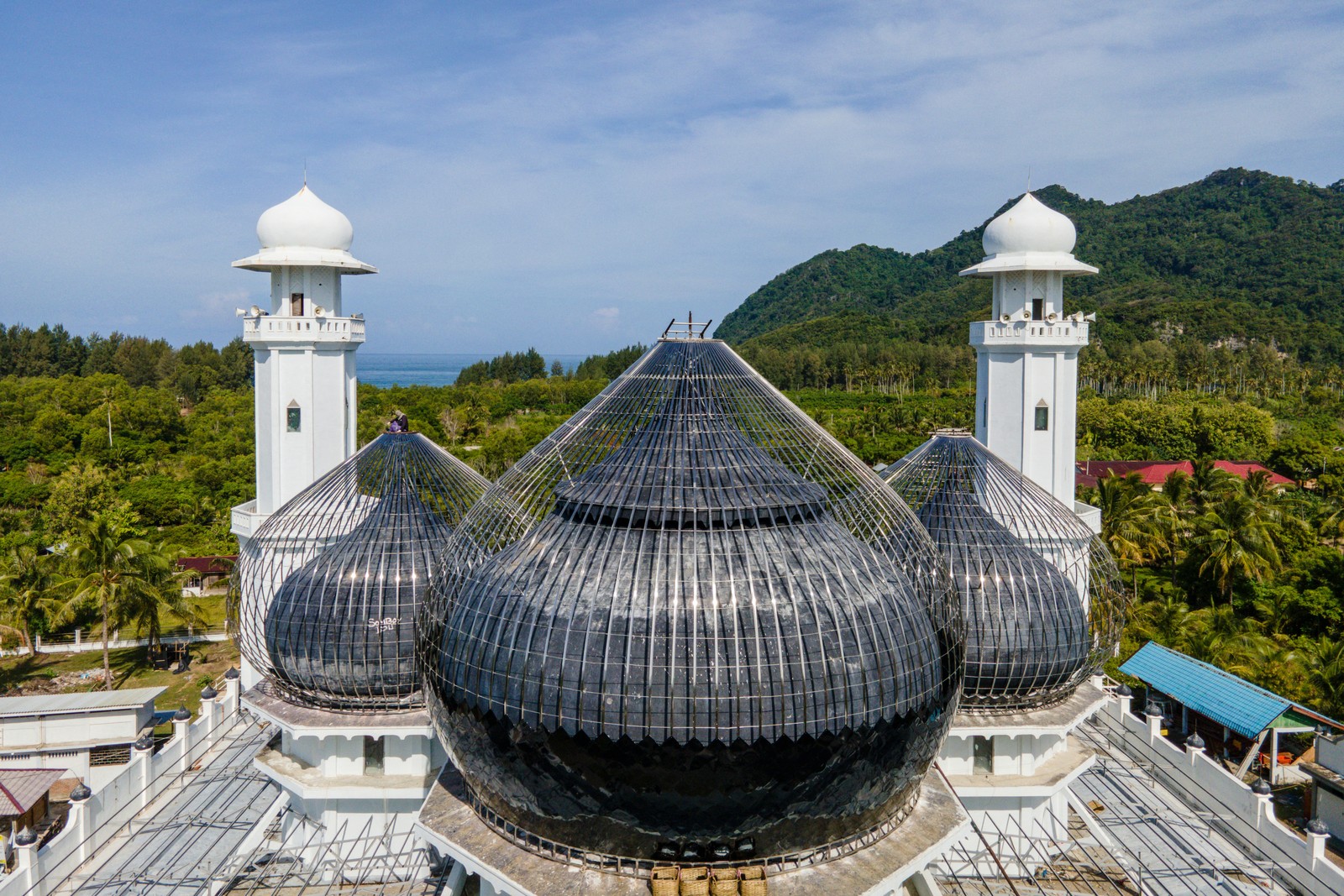 A rooftop view of a mosque that is undergoing reconstruction.