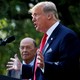 President Donald Trump announces a policy as Commerce Secretary Wilbur Ross looks on