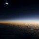 A total solar eclipse as seen from the window of a plane