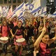 Demonstrators wave the flag of Israel during a march against the government's judicial reform plan in Tel Aviv