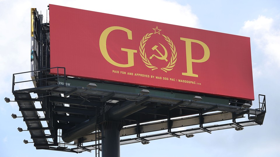 Activist sign replacing the O in GOP with a hammer and sickle