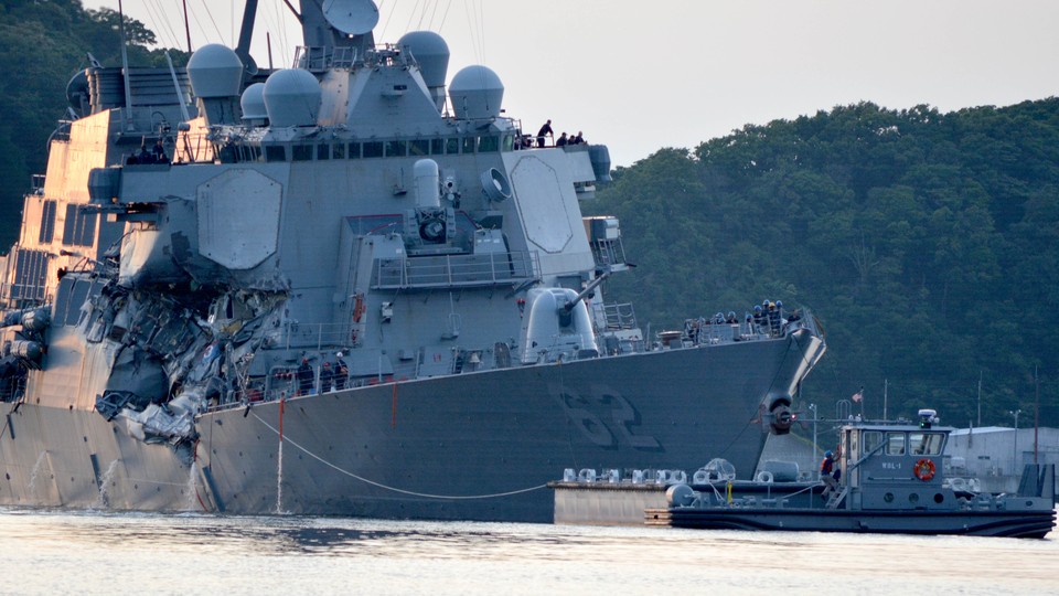 The U.S. Navy Arleigh Burke-class guided-missile destroyer USS Fitzgerald returns to base after a collision.