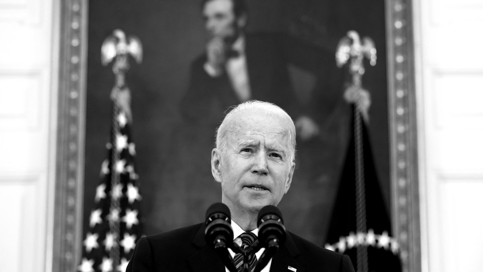 Joe Biden speaking at the White House with a portrait of Abraham Lincoln behind him
