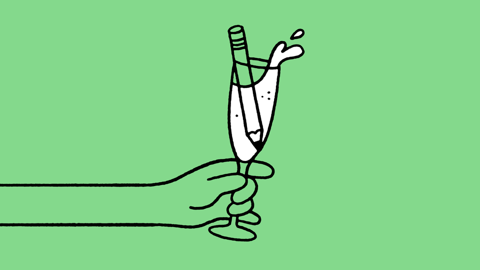 An illustration of a champagne glass with a pencil inside