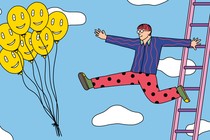 A man leaps off a ladder toward a group of happy-face balloons