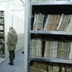 A visitor looks at a shelf containing documents during a public day at the Federal Department for the Stasi Records in Berlin.