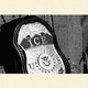 Photo-illustration showing an ICE badge up close in black-and-white.