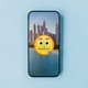 A zipped-lips emoji is superimposed over a picture of the Dubai skyline.