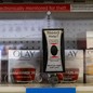Olay products behind a plastic barrier