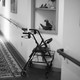 A walker sits in the hallway of an assisted-living facility.