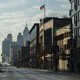 People walking along a deserted street in Detroit, Michigan