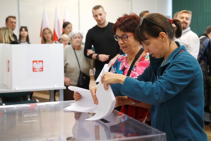 Women cast their votes during Poland's election.